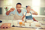 Food, cooking and family with happy black father and daughter bonding and being silly in a kitchen, Single parent teaching his child how to prepare a healthy and nutrition meal, having fun at home