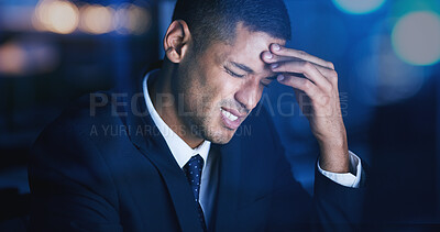 Buy stock photo Headache, stress and burnout with businessman working late night in corporate office building. Anxiety, mental health and migraine pain with audit, tax or risk company employee sitting at desktop