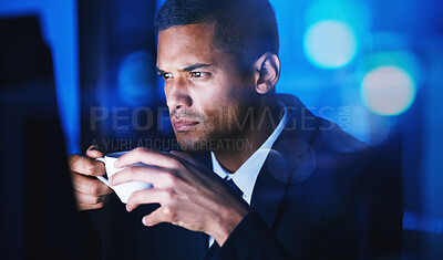 Buy stock photo Businessman drinking a cup of coffee while working overtime in the office at night time. Corporate, company and professional manager sitting at desk and analyzing data, documents and reports at work.