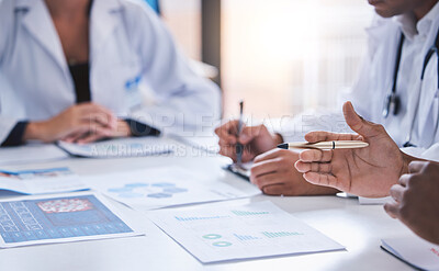 Buy stock photo Team, medical analysts and doctors consulting with paperwork of graphs, data and charts in hospital conference room. Closeup of healthcare staff discussing statistics, results and innovation strategy
