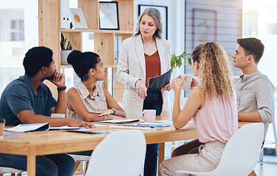 Buy stock photo Ceo woman consulting young team, explain business strategy and professional working together. Group of employees listen to boss, corporate office manager planning meeting and solution focused staff