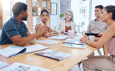 Buy stock photo Teamwork, collaboration and planning with business people in a creative meeting, discuss strategy in a corporate office. Diverse, serious designer united on a goal or mission, sharing idea and vision