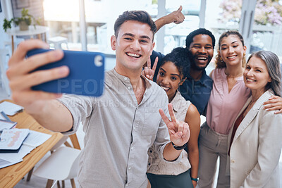 Buy stock photo Selfie, diversity and teamwork with happy business people showing peace sign in startup office. Positive workplace and employee engagement for motivation with healthy staff in a fun work environment