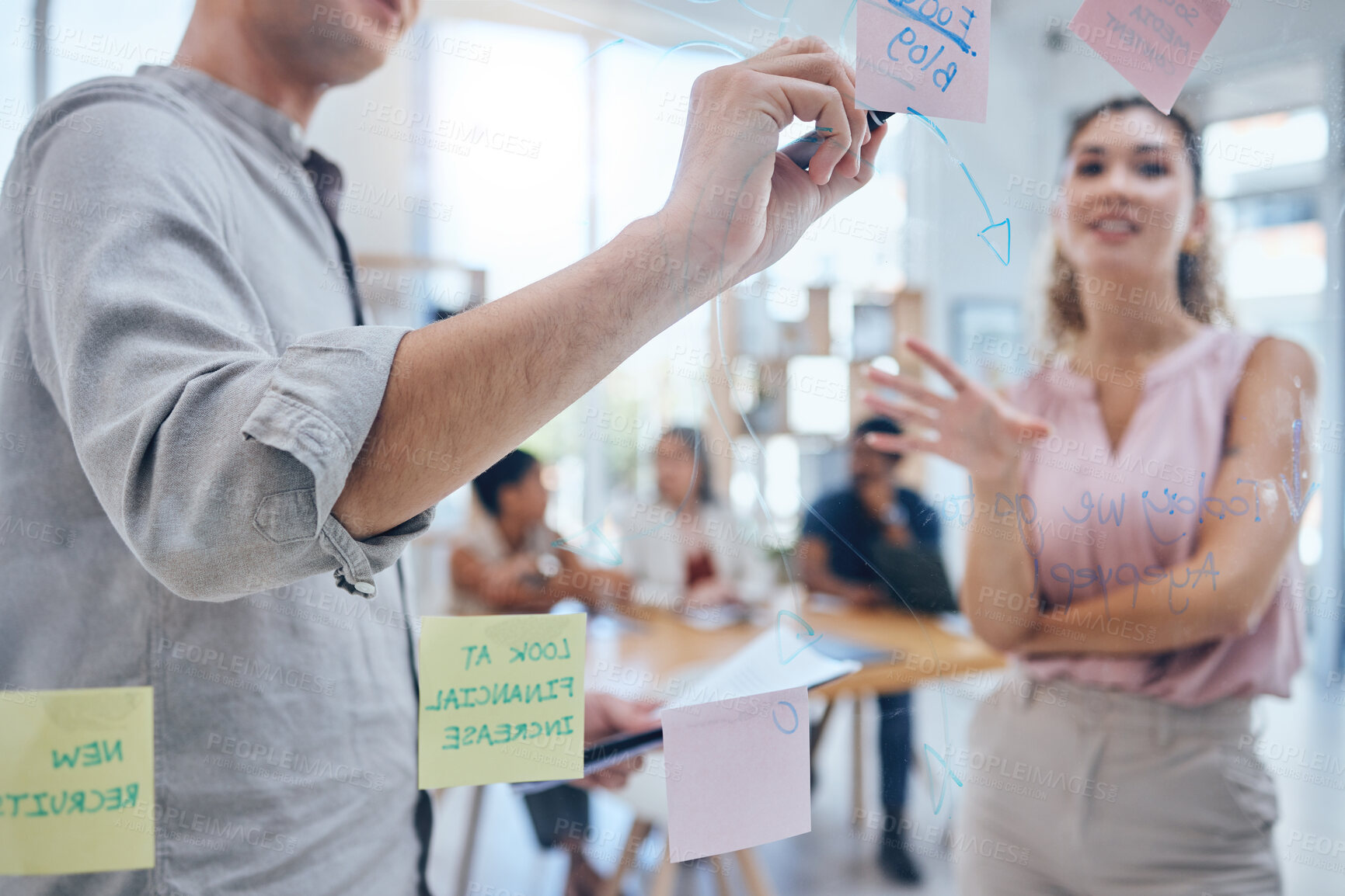 Buy stock photo Teamwork, sticky notes and business on a board or moodboard in a modern company office. Corporate team, people or staff working together on a pinboard in communication and planning a strategy.