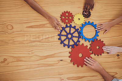 Buy stock photo Success, collaboration and teamwork, people with gears on a wooden table. Diversity, hands and a team of business people working together. Planning, strategy and cooperation for solution in an office
