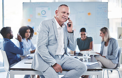 Buy stock photo Leadership, phone call and communication while a ceo sit in a meeting with a team of corporate men and women. Workers in at presentation with senior manager while talking on phone in conference room