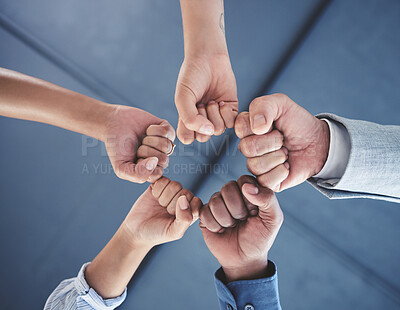Buy stock photo Team success and motivation fist bump of business people with teamwork, work support hand sign. Office group hands together in a circle to show job community, goal collaboration and career target 