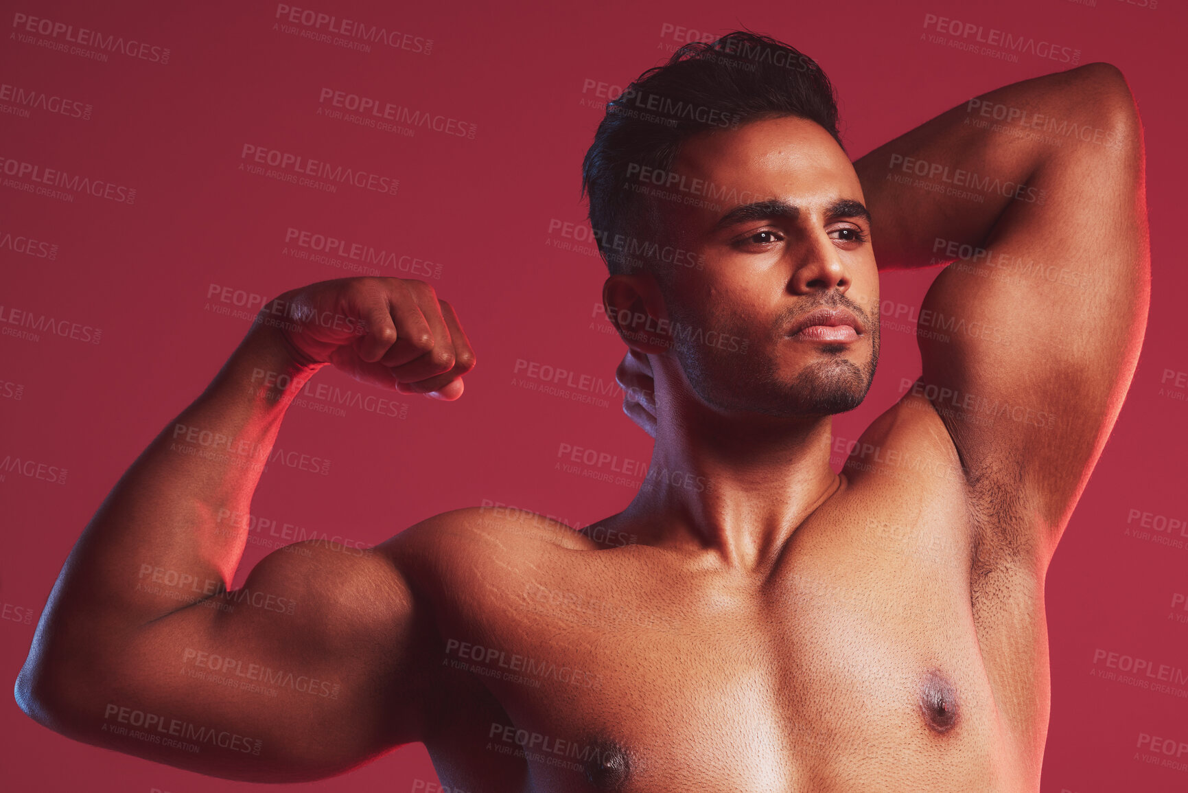Buy stock photo Fitness, health and nude man with muscle on a red studio background. Exercise, training and sports with a proud, strong and muscular weightlifting bodybuilder flexing his bicep after strength workout