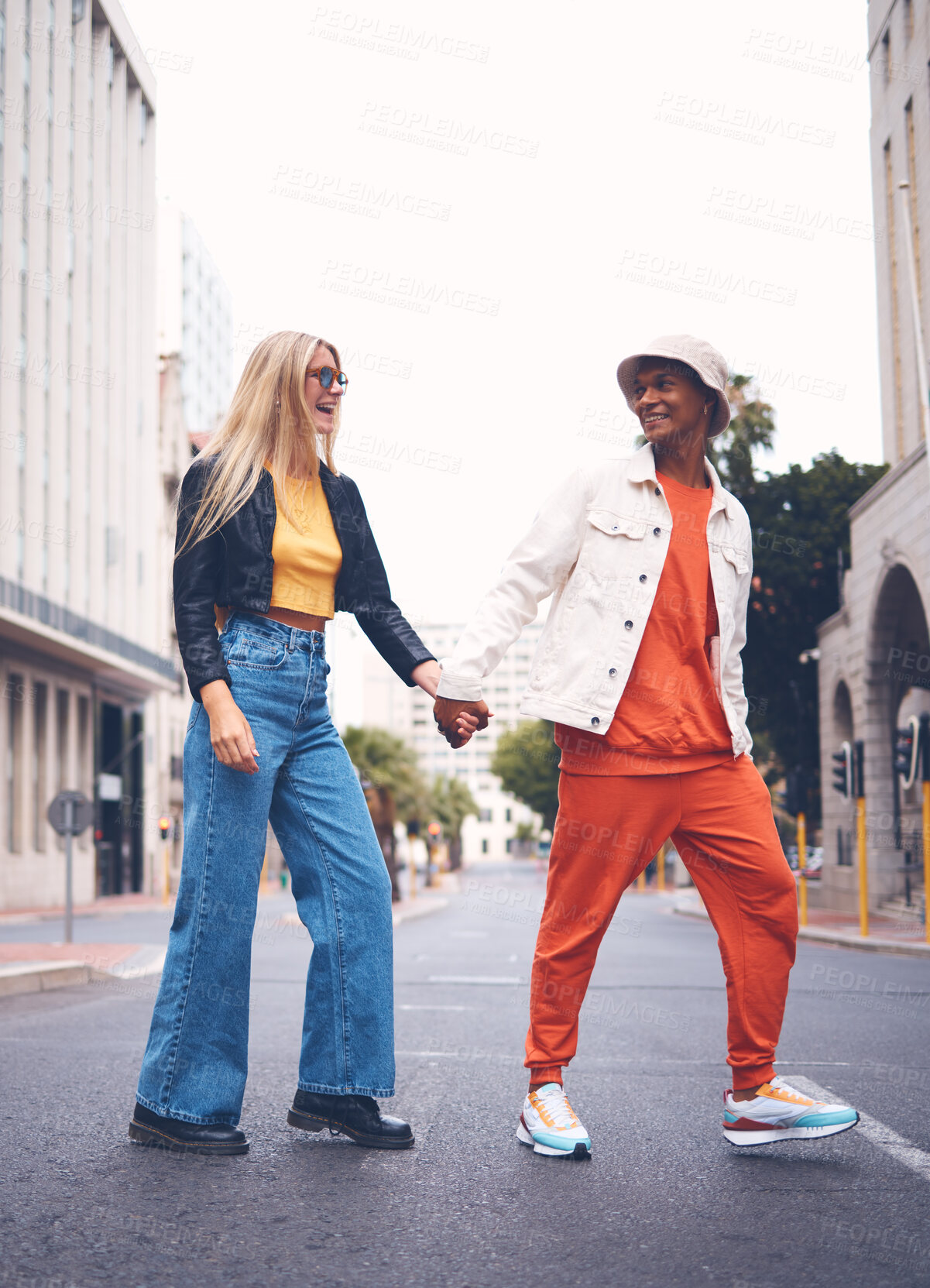 Buy stock photo Happy interracial couple with fashion clothing in a urban city street with a smile and love. Trendy, stylish or punk man and woman walking in a town road with funky, edgy and style together   