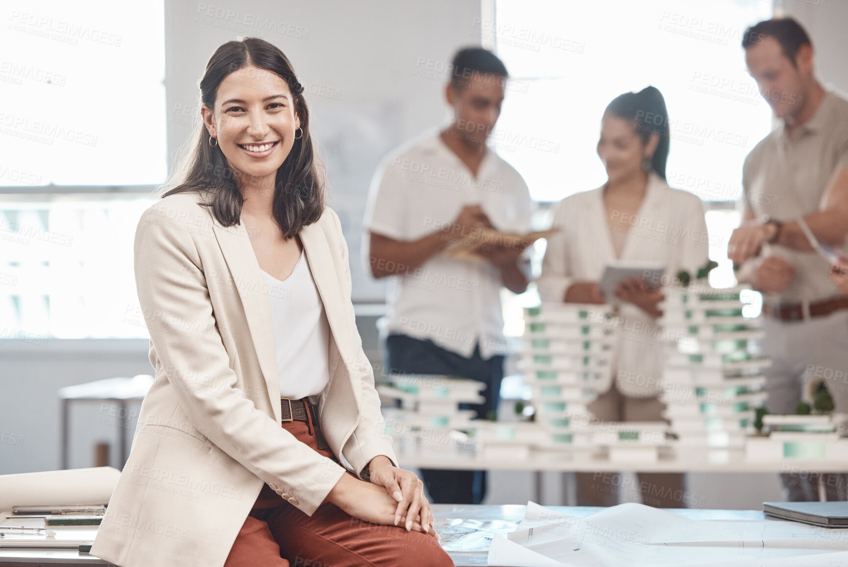 Buy stock photo Architect woman, portrait and smile at office brainstorming meeting for project model with staff. Building and 3d design employee happy with development of construction plan with the team.