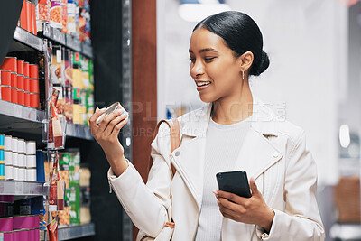 Buy stock photo Supermarket, shopping and customer with smartphone check price, label or product information online. Retail consumer woman with food or grocery checking discount code or sales choice on a digital app