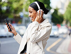 Happy city girl with phone and headphones on video call while walking relax in the street to work or home. Black woman or student laughing at joke, meme or online video while on travel to a location