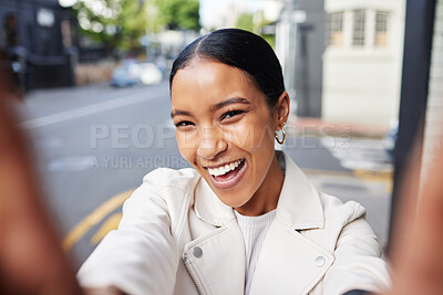 Buy stock photo Girl social media influencer taking a selfie portrait on city street outdoors to post it online. Fashion, swag and young woman with a cool white leather jacket happy, smile and smiling on the road