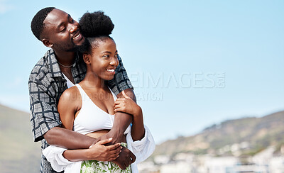 Buy stock photo Young, love and black couple on beach hug while bonding together in blue sky seaside scenery. Happy African American people in joyful relationship embrace each other on peaceful outdoor date.