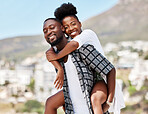 Portrait, black couple and back ride with a smile in nature outdoors on a date, trip or vacation. Love, romance and happy man and woman together with male carrying female on his shoulders outside.