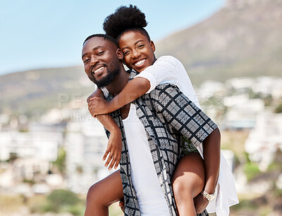 Buy stock photo Portrait, black couple and back ride with a smile in nature outdoors on a date, trip or vacation. Love, romance and happy man and woman together with male carrying female on his shoulders outside.