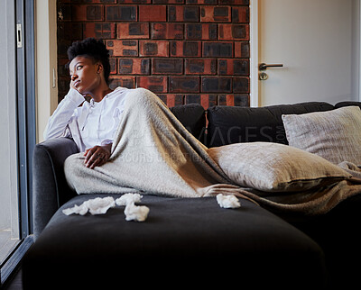 Buy stock photo Sick, sad and bored woman with covid, thinking of mental health on sofa in home and depressed in living room of apartment. Frustrated, fail and African girl with depression on couch in house