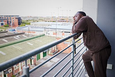 Buy stock photo Sad, burnout and depression man with health, anxiety and thinking of mental health on balcony in house. Depressed, frustrated and tired African man with fail, stress or headache pain from work report