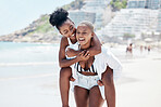 Friendship, gay and lesbian with black women enjoying a piggyback ride and fun at beach in summer. Friends, dating and trust with female and her girlfriend on holiday, vacation or travel by the coast