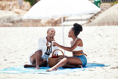 Buy stock photo Black women, friends and cheers with beer on a beach in nature on a hangout, vacation or holiday. Drinking, happy African girls and a smile with refreshing alcohol, beverage or liquor by the shore.

