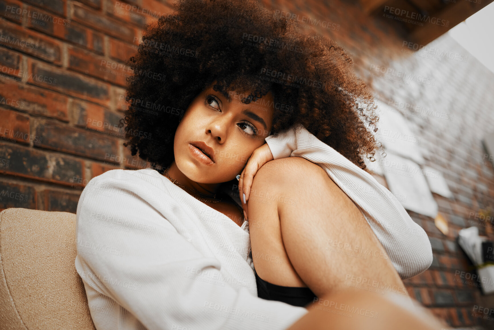 Buy stock photo Thinking, stress and black woman with anxiety about life, loneliness and depression. African girl alone, thoughts on trauma and poor mental health in her apartment, home or house on a couch or sofa

