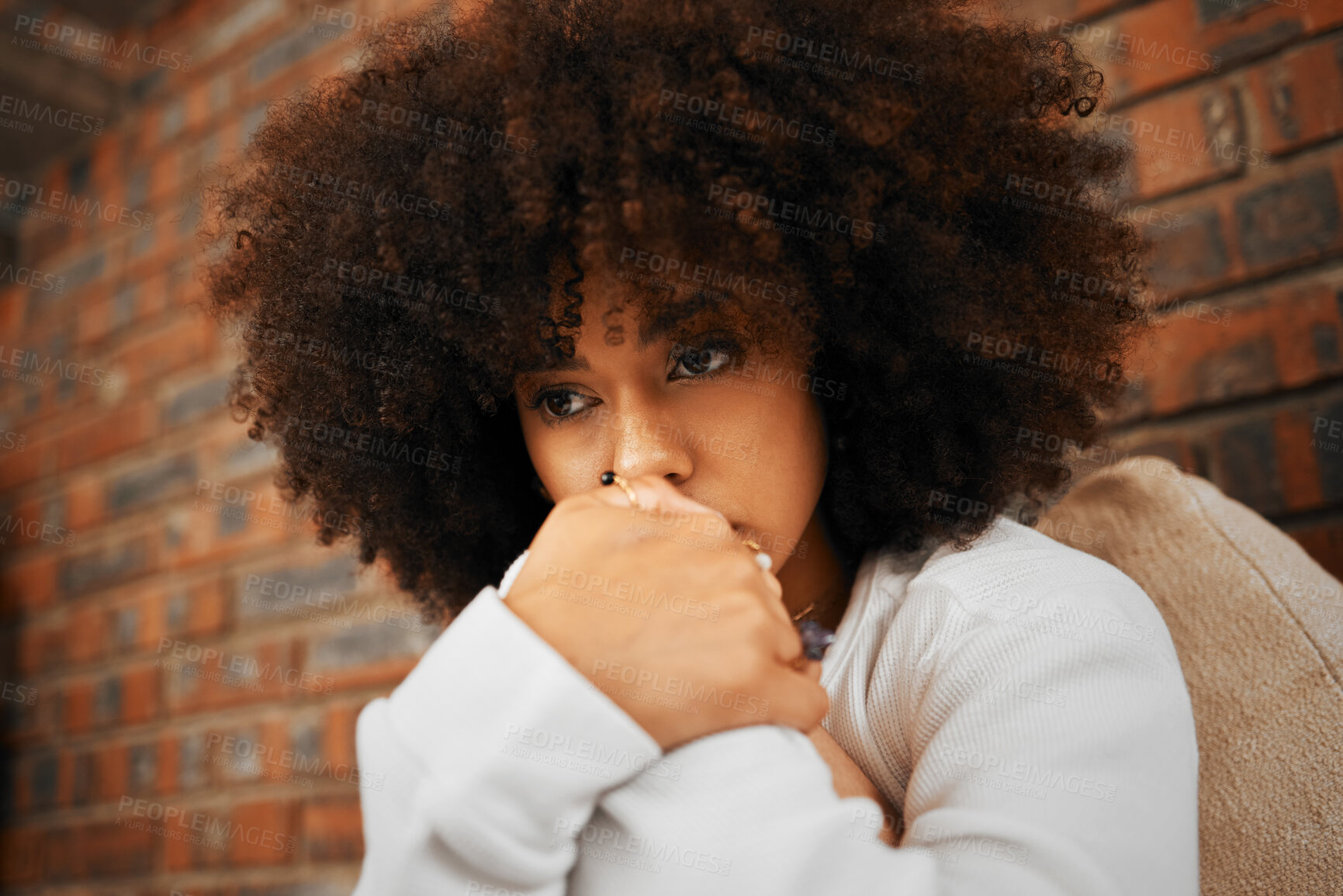 Buy stock photo Fear, sad or depression of a young woman sitting with depressed expression or thinking of a problem. Worried and alone african American woman after a bad fail, anxiety or mental health issues 