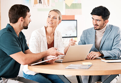 Buy stock photo Business people planning marketing strategy in meeting, talking about online company website on laptop and team for advertising partnership at work. Employees in conversation about corporate goal