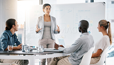 Buy stock photo Corporate manager planning a project on a whiteboard with her team doing research in modern office. Group leader explaining her creative strategy at a business meeting in the company conference room.