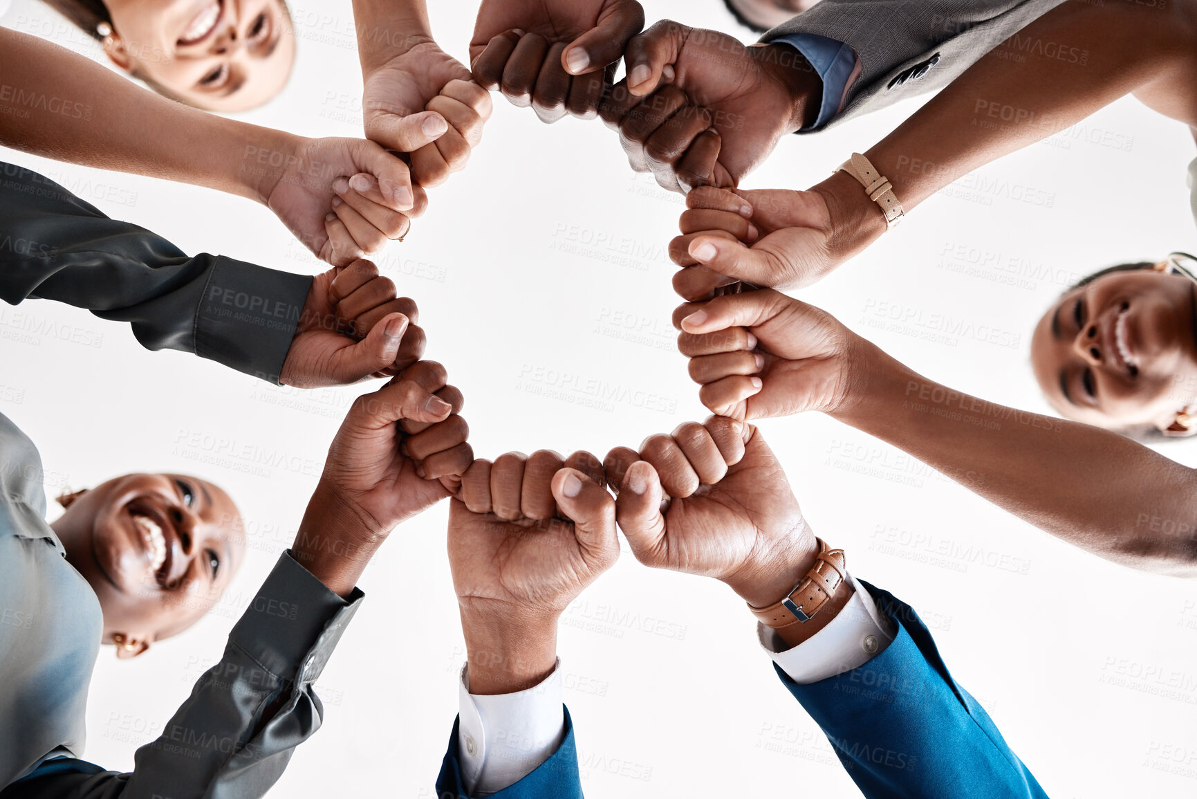 Buy stock photo Hands, collaboration and motivation with a business team in a huddle with fists and a mindset of company vision. Mission, teamwork and goal with a group in a circle ready for growth and development