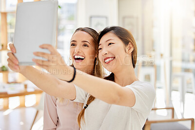 Buy stock photo Tablet, happy and women taking a selfie at work on a break to post it on social media on a network app. Smile, friends and business people on a fun online video call about a digital startup agency