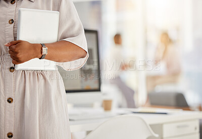 Buy stock photo Tablet, technology and internet with the hand of a business woman holding a wireless device in her office with colleagues in the background. Wifi, communication and networking with modern tech 