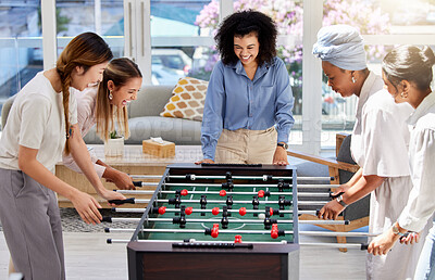 Buy stock photo Table football or soccer as office women play a fun foosball game together on their lunch break at work. Entertainment, happy and female friends in a friendly match competition to enjoy free time