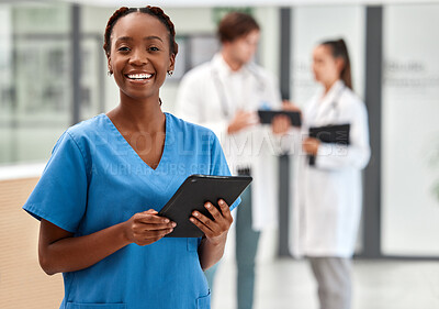 Buy stock photo Portrait of happy woman doctor working on a digital tablet and smile while working at a hospital. Black female nurse doing medical and healthcare research on the internet or online at work at clinic