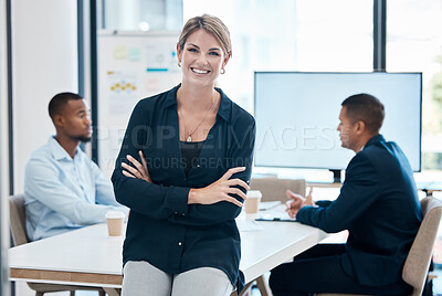 Buy stock photo Female leader, manager or CEO with a business woman in a meeting for planning or strategy and her team in the background. Management, leadership and training with a group in a boardroom for training