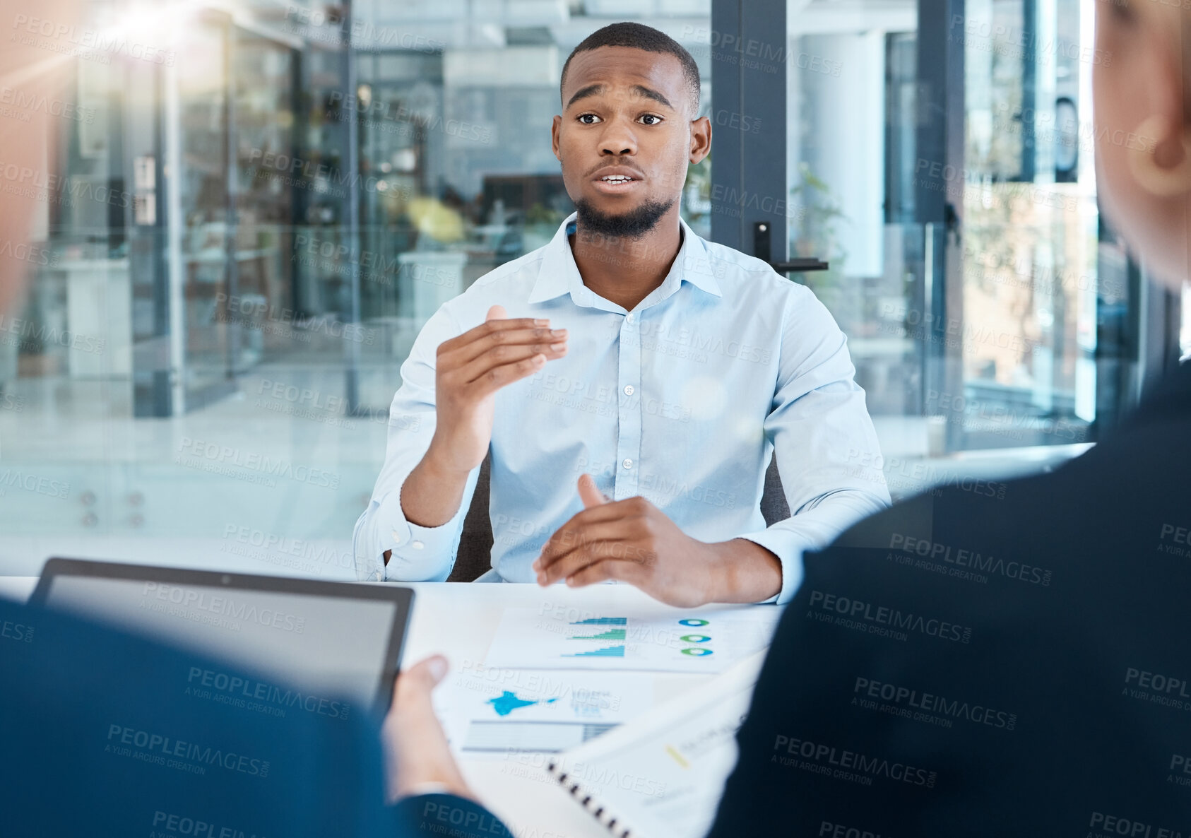 Buy stock photo Black man, interview and office presentation to business team on analysis, data and research. African man in corporate discussion explaining company strategy and analytics for innovation and goals