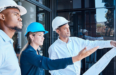 Buy stock photo Building, architecture and engineering team at construction development project with the floor plan blueprint paper. Creative industry designers planning, collaboration and working outdoors together
