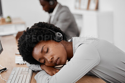 Buy stock photo Call center, burnout and sleep of a woman employee resting on a desk at the office. Exhausted black female telemarketing agent or consultant in customer support or service sleeping on the job at work