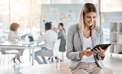 Buy stock photo Business woman working on a digital tablet in a corporate meeting with a team in an office. Professional employee doing research on a company website for a collaboration project in a conference room.