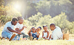 Black family, nature picnic and bond with children, parents and grandparents in remote countryside field in summer. Mother, father or senior with girls eating food on park grass with background trees