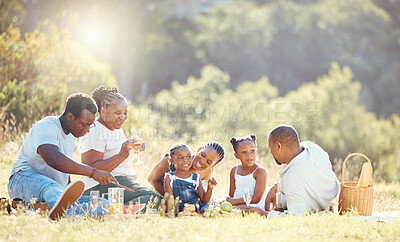 Buy stock photo Black family, nature picnic and bond with children, parents and grandparents in remote countryside field in summer. Mother, father or senior with girls eating food on park grass with background trees