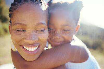 Buy stock photo Happy black mother and playful daughter having fun together in the sun. Carefree woman carrying excited girl for a back ride while bonding outside. Single mom enjoying quality family time with kid