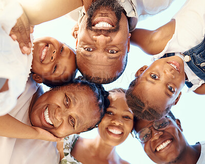 Buy stock photo Happy black family in a huddle, face smile with mother, father, grandmother and their cute children from below. Group of people with support, trust and love together outdoor with blue sky background