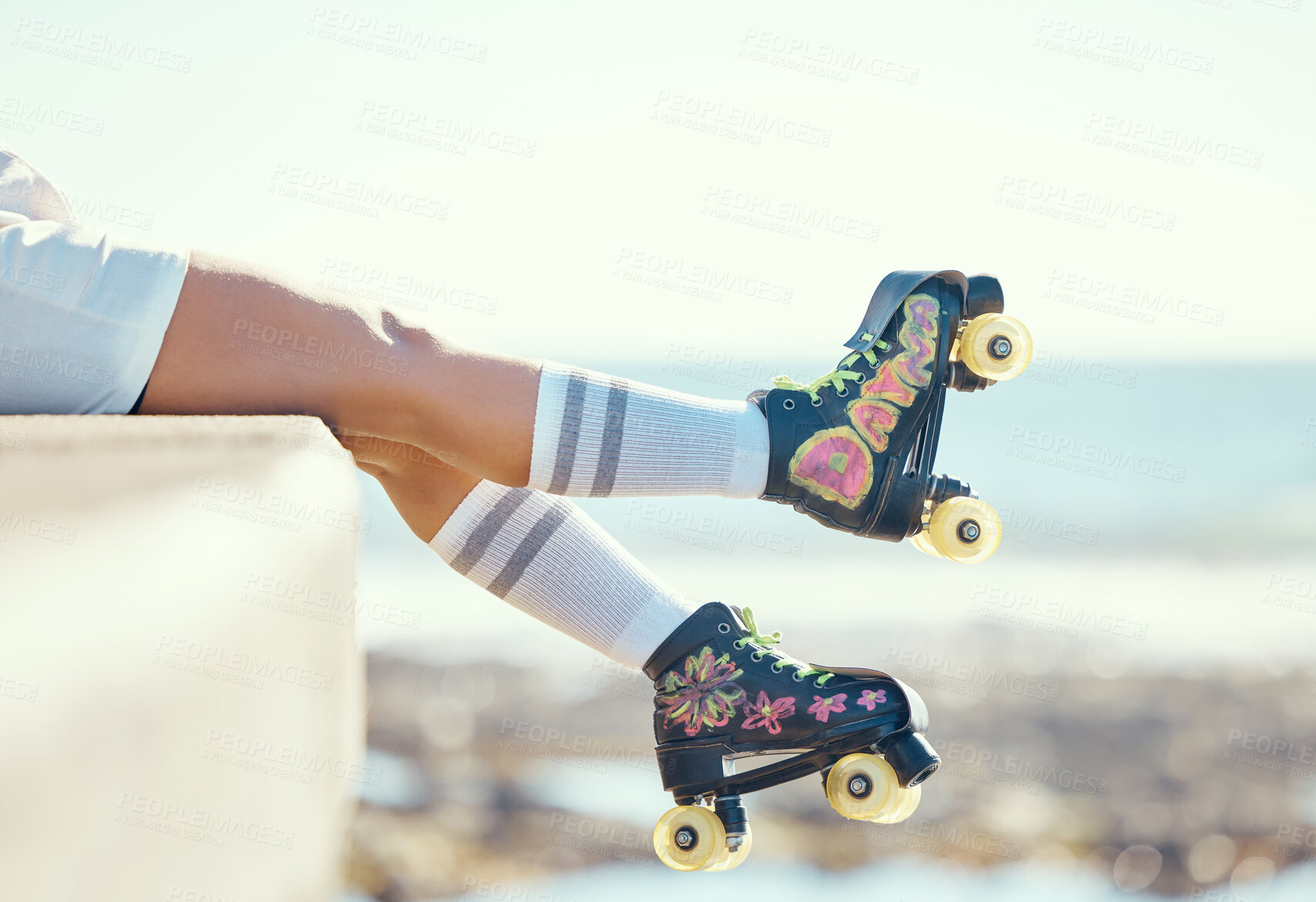 Buy stock photo Relax roller skate woman legs at beach, ocean harbor or sea water with holiday fun, freedom and adventure travel. Feet of sports athlete or skater girl with skating shoes for summer outdoor journey