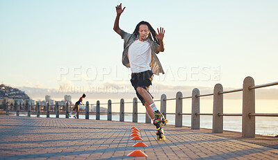 Buy stock photo Roller skating, man and fun sports by ocean, sea or beach in Florida in freedom exercise, workout drill and training at sunset. Fashion or cool local in wellness fitness skill in city park or street