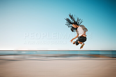 Buy stock photo Sport, fitness and freedom man roller skates with speed and jump in blurred motion exercise, training and workout at beach. Happy, sports and healthy energy with action, free and health retro skating