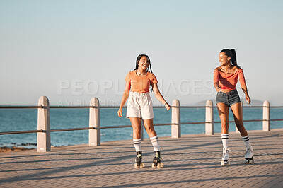 Buy stock photo Friends roller skating on the promenade at the beach during a summer vacation in South Africa. Happy, active and young girls doing a fun activity in nature on the ocean boardwalk while on holiday.
