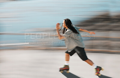 Buy stock photo Fitness, exercise and a man on roller skates moving fast with blurred background. Action, movement and an adrenaline rush skating in road. Speed, sports and a dreadlocks skater having fun in the sun.