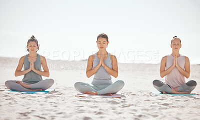Buy stock photo Beach meditation, women or zen friends in mental health wellness exercise, pilates training or mind reiki energy yoga. Relax, namaste prayer hands or people in peace breathing support workout on sand