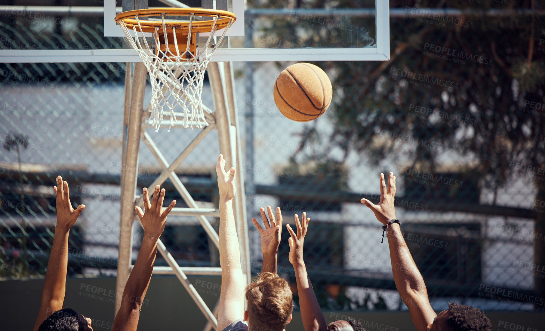 Buy stock photo Basketball, sports and fitness with friends on a court for sport, health and exercise outside during summer. Training, workout and recreation with a team of players playing a game or match outdoors