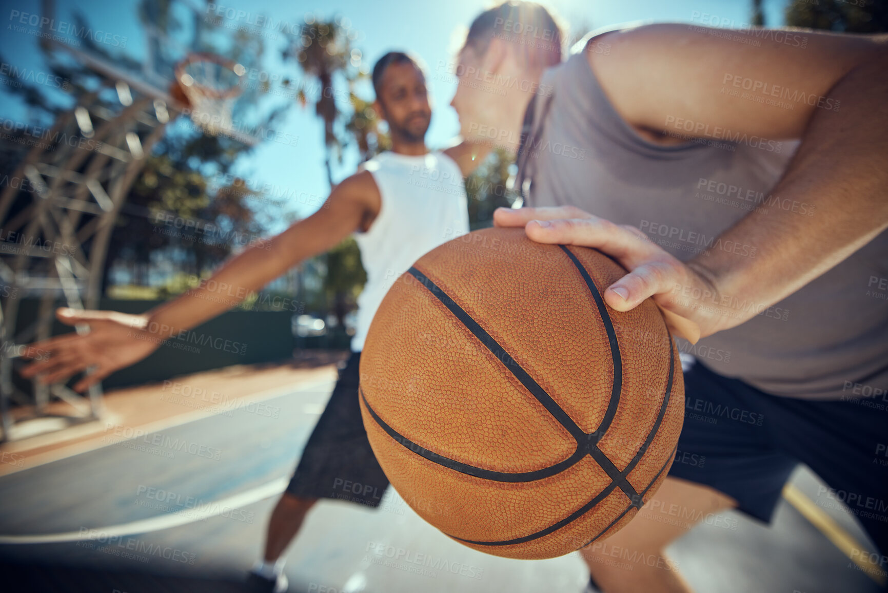 Buy stock photo Basketball, competitive sports and practice match with men, players or friends playing a game at an outdoor court. Athletes staying fit and enjoying leisure activity with a ball while trying to score